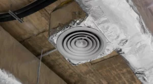 hvac air duct and air vent hanging from the ceiling of a building